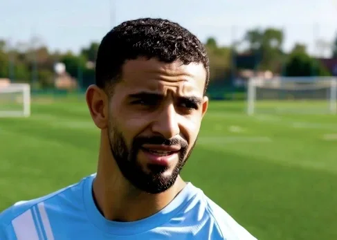 Rayan Ait-Nouri in action for Manchester City, competing for the ball on the left wing